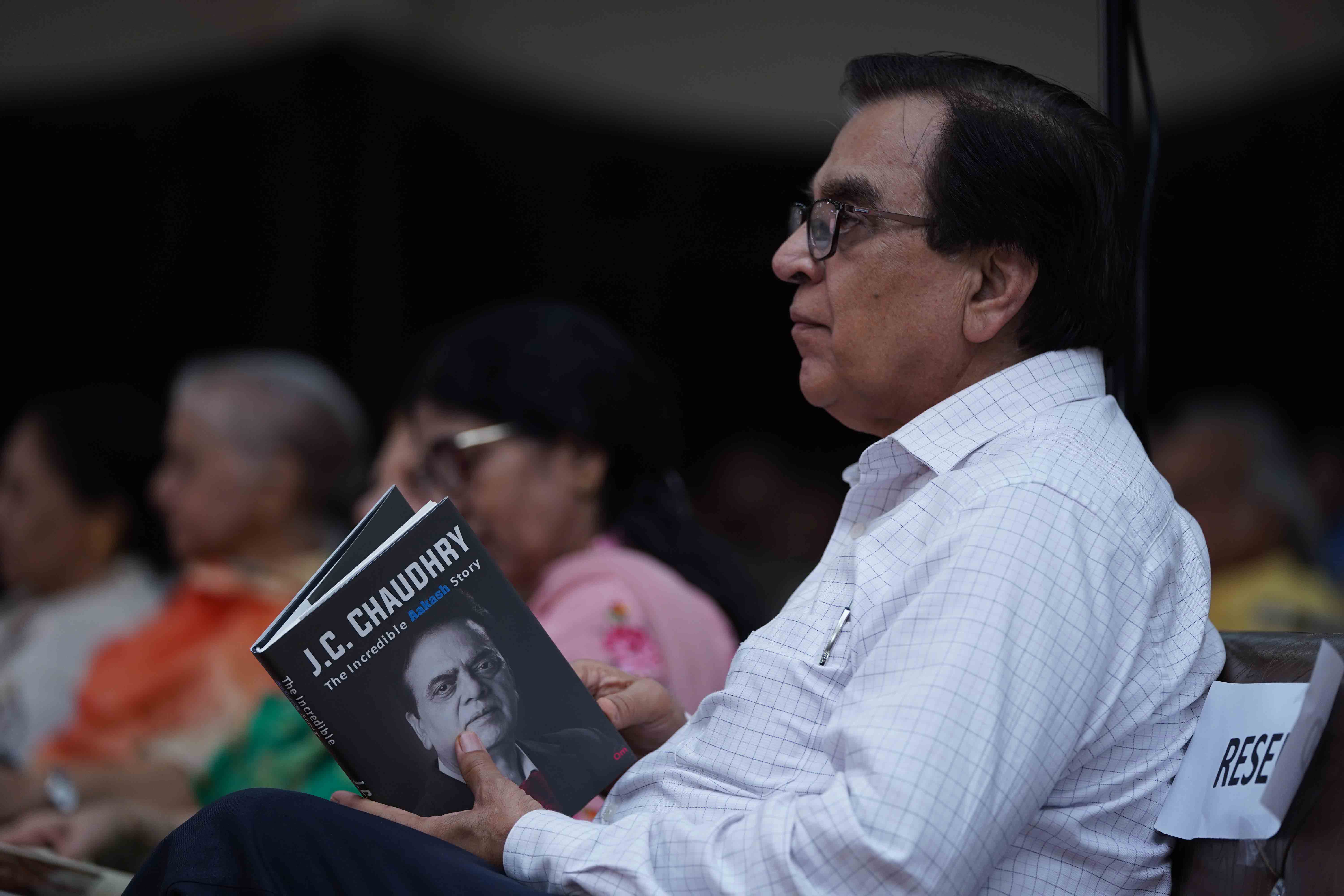 Mr J D Chaudhry holds biography book